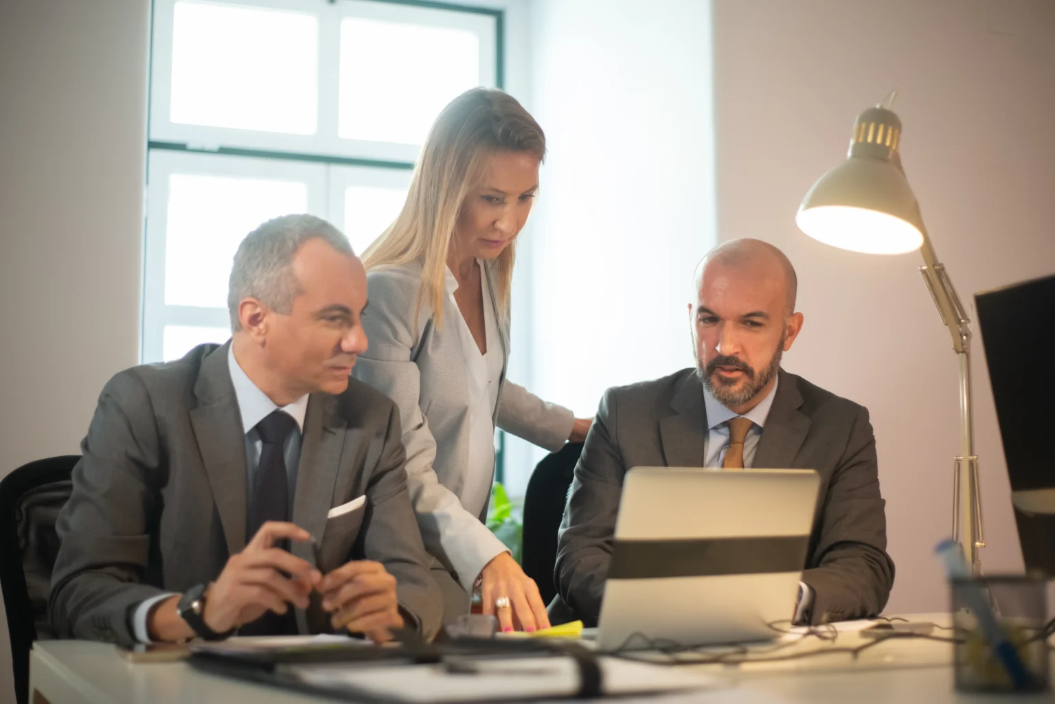 business officiails looking at their performance documents